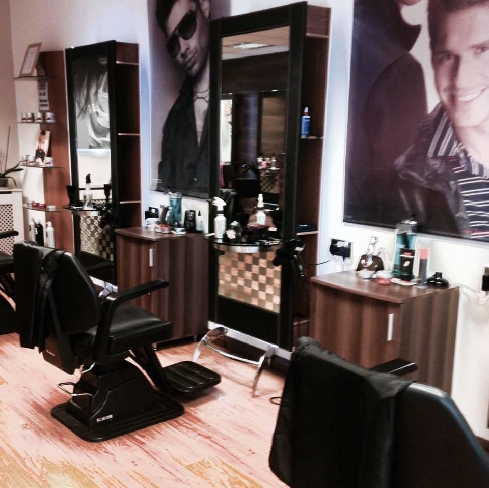 Barber chairs and mirrored stations inside the shop